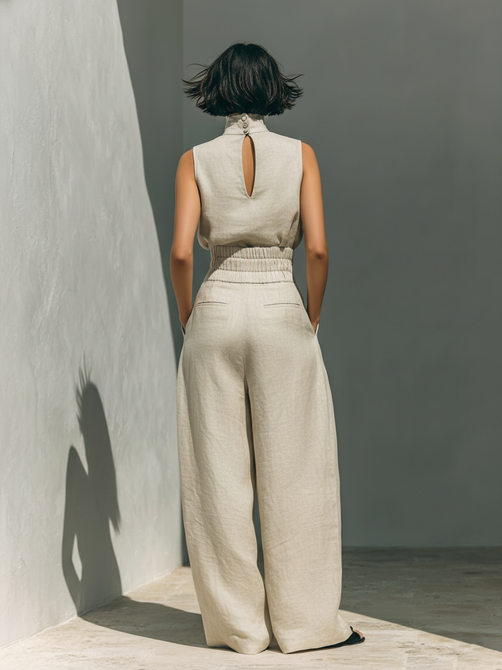 Dames minimalistische set met mouwloze blouse en wijde broek