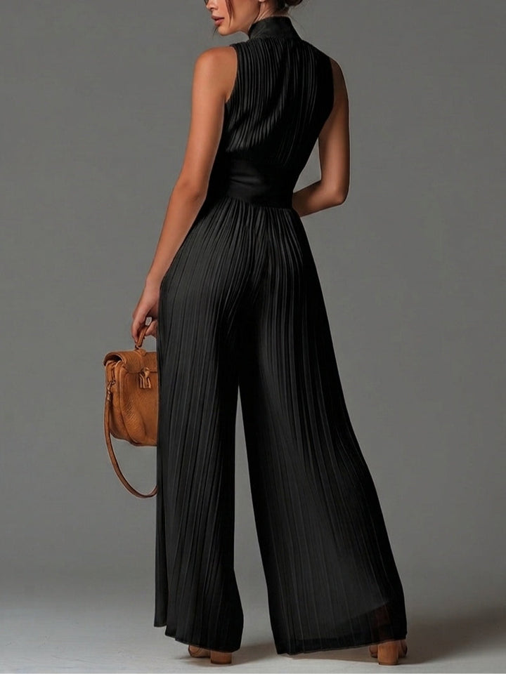 Zwarte mouwloze jumpsuit van chiffon met V-hals, rits, plooien en wijde pijpen